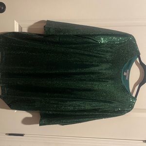 Beautiful emerald green sequin top. Never worn only tired on.  Size 20
